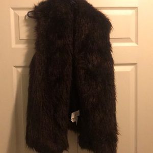 Large dark burgundy fur waste length vest.